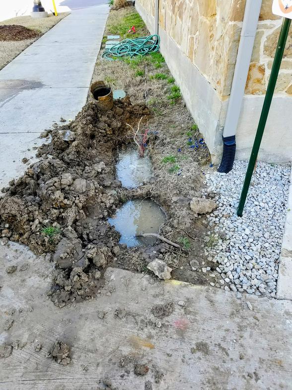 Emergency irrigation leak repair near sidewalk in Plano Texas